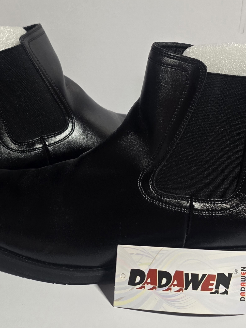 DADAWEN Men's Chelsea Boots in black, featuring smooth synthetic leather uppers